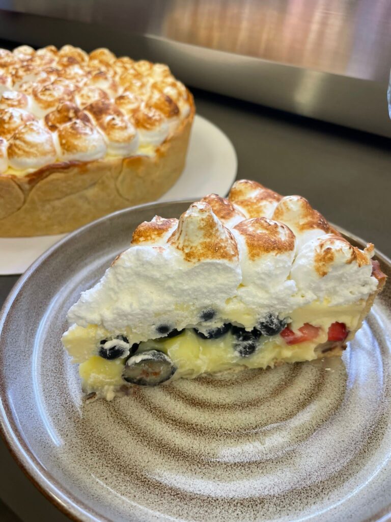Lemon and blueberry meringue tart at  Chez Amelie Cafe
